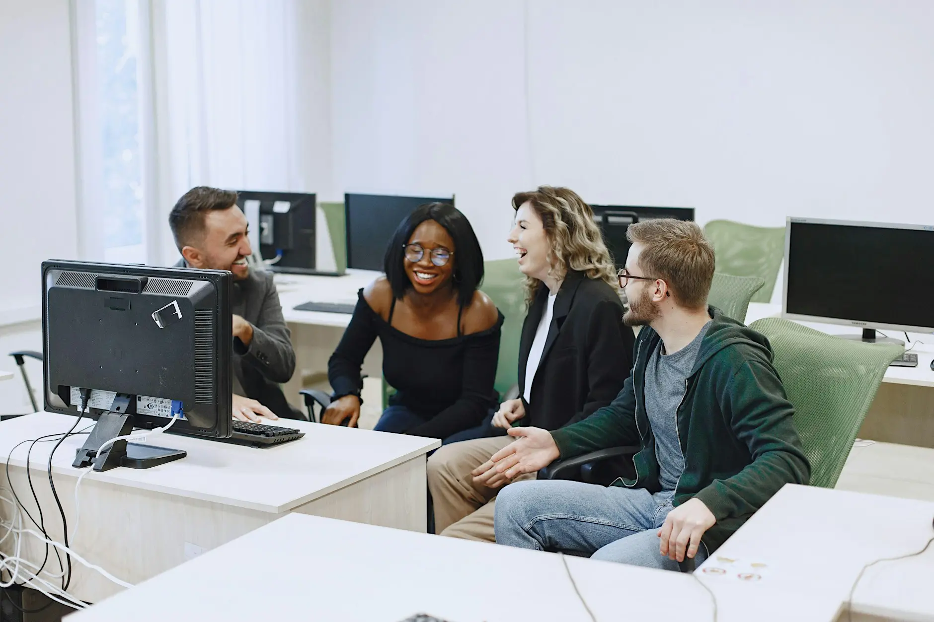Group of adults sitting around a table chatting