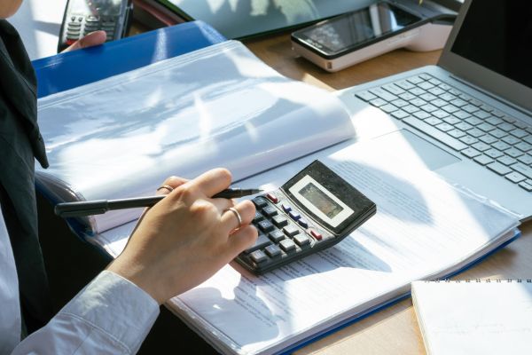 View of a desktop with calculator and pen